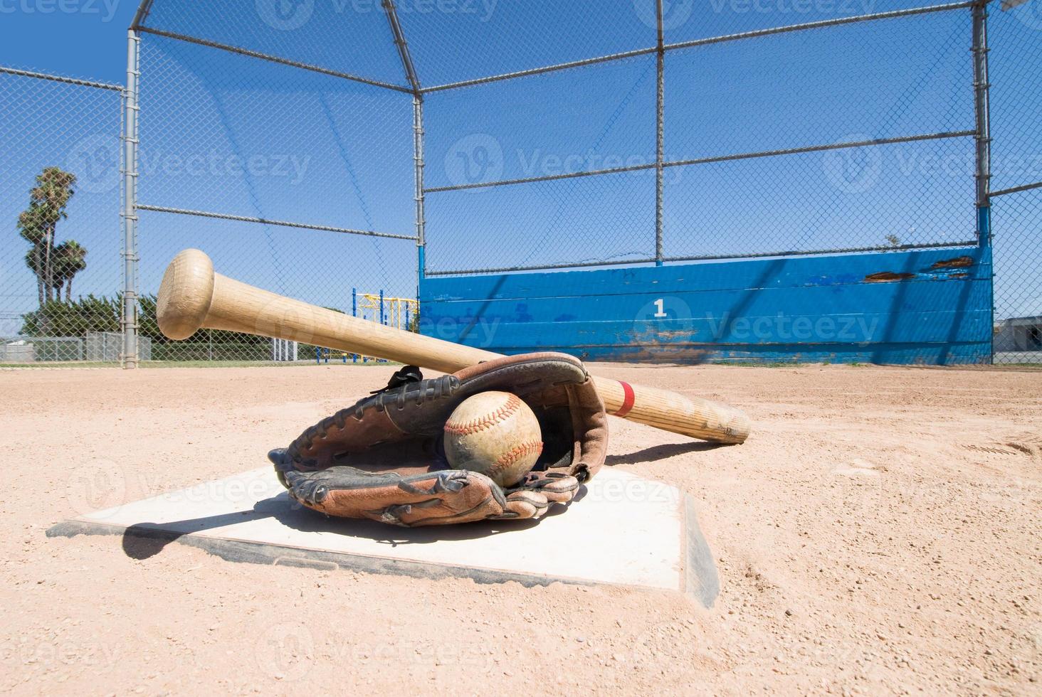 Baseball equipment on home plate photo
