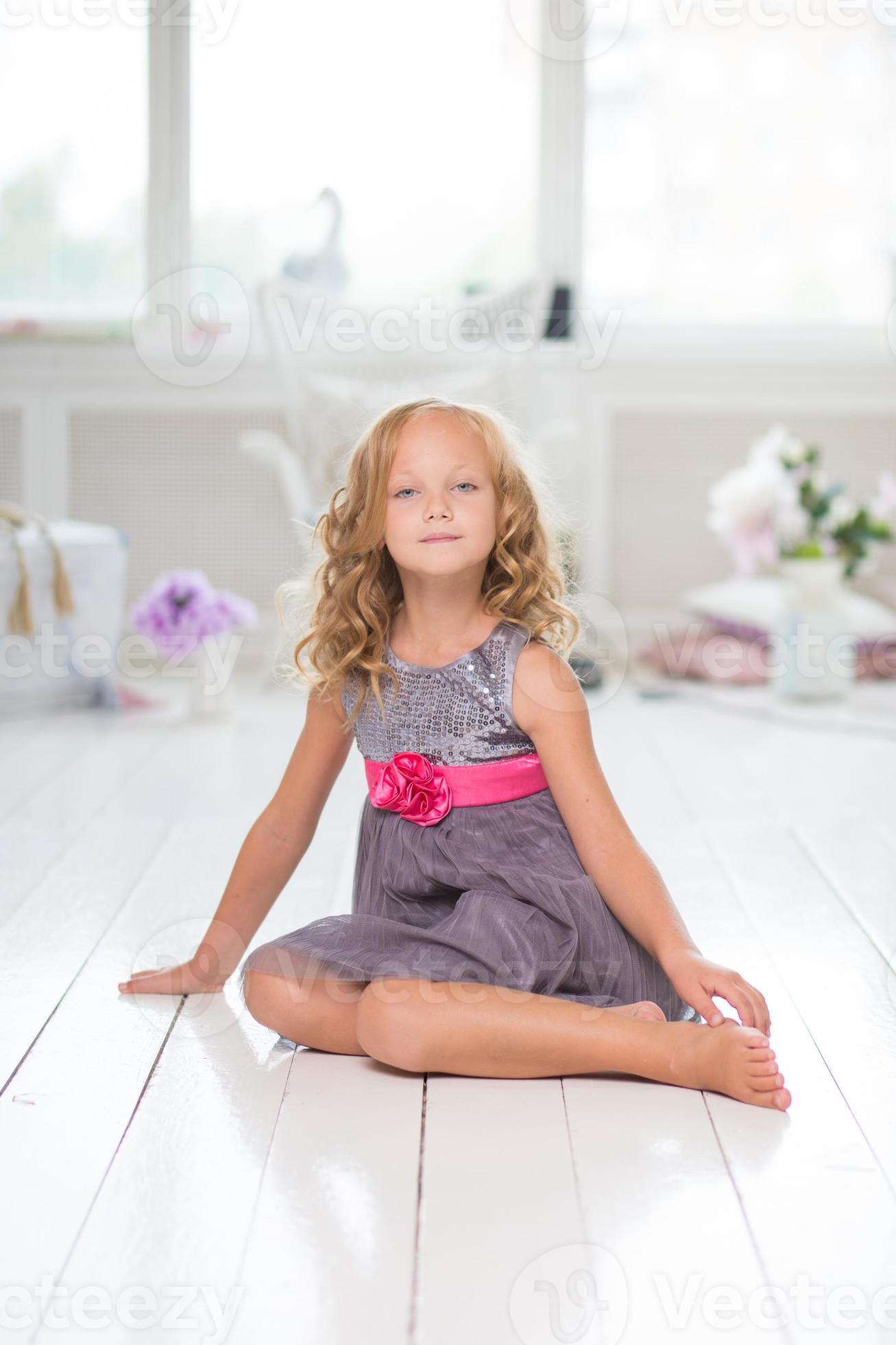 Adorable little girl in her room 937054 Stock Photo at Vecteezy