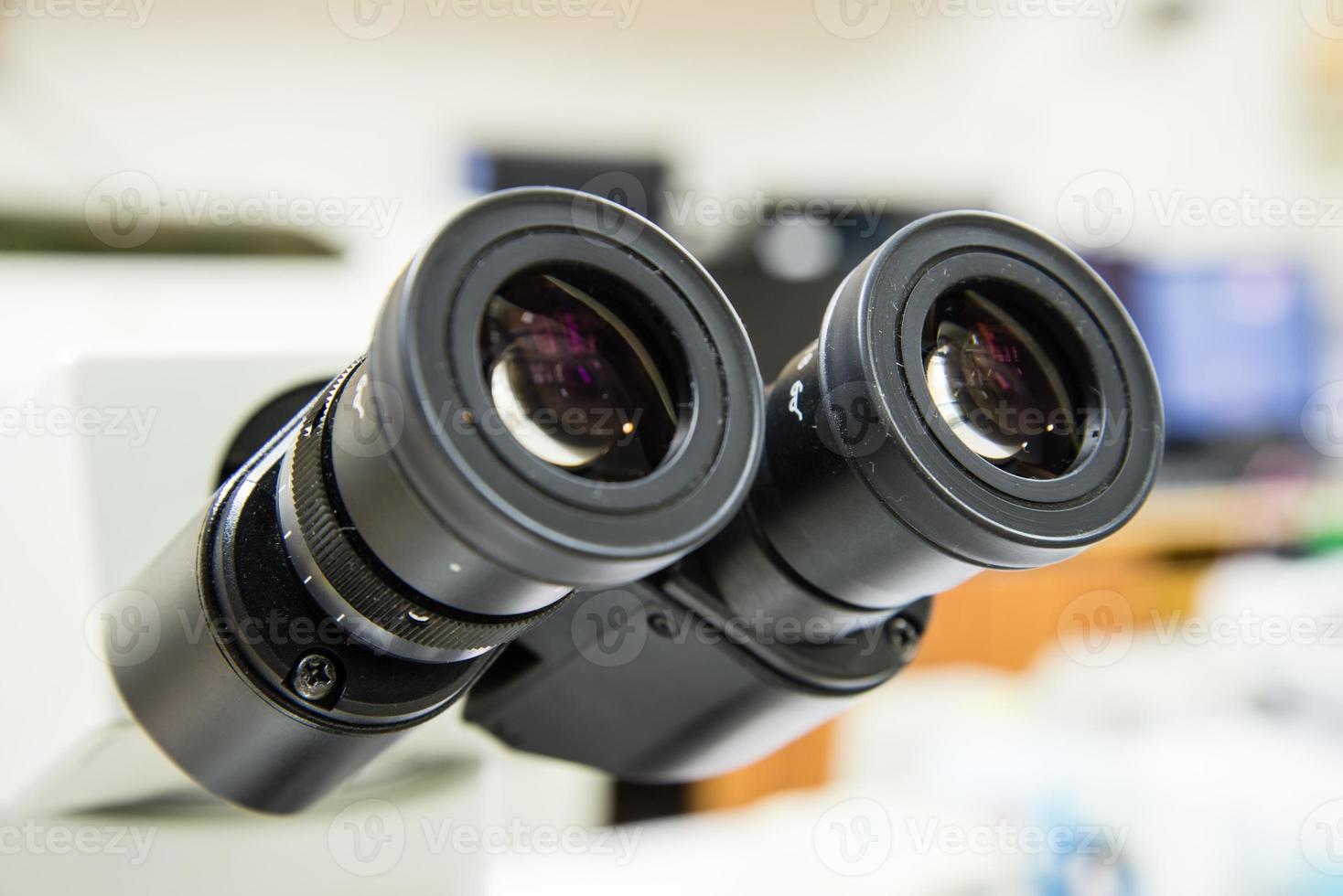 Closeup eyepieces microscope. photo