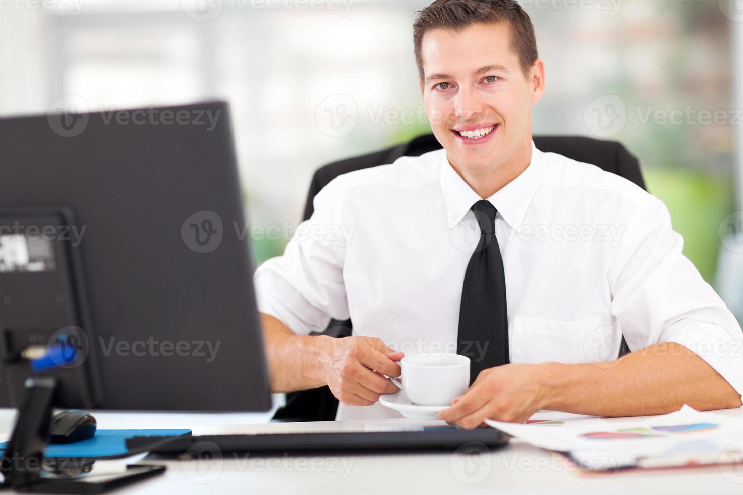 young office worker drinking coffee 937557 Stock Photo at Vecteezy
