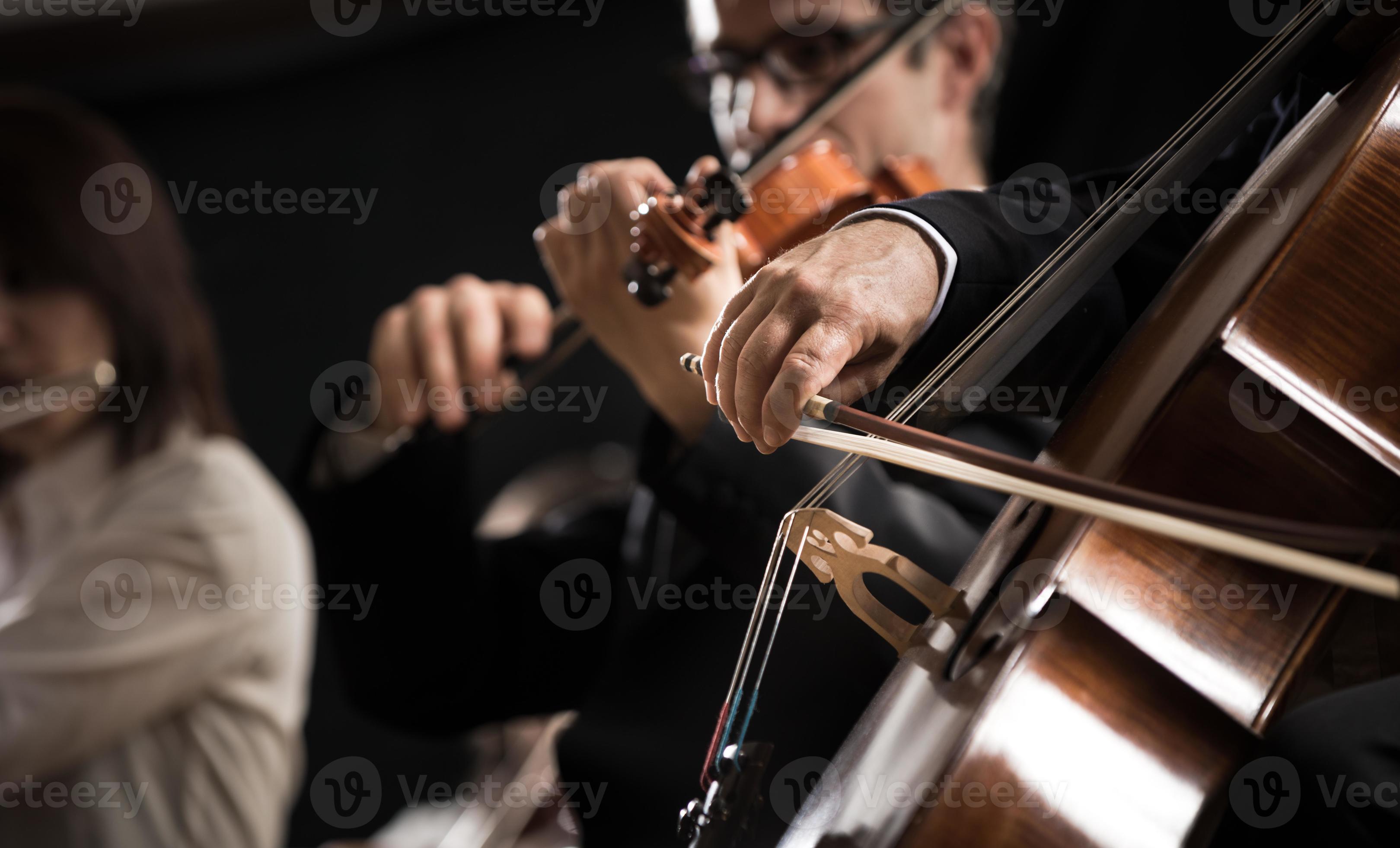 Symphony orchestra: cello player close-up photo