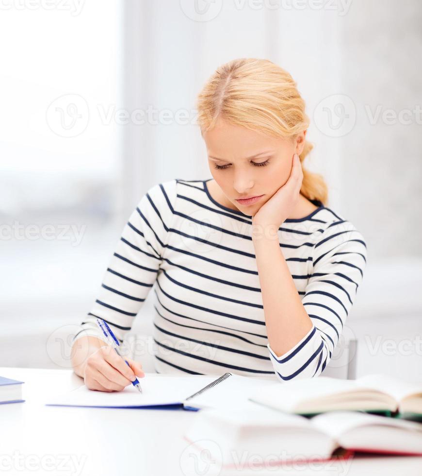bored student woman studying in college photo