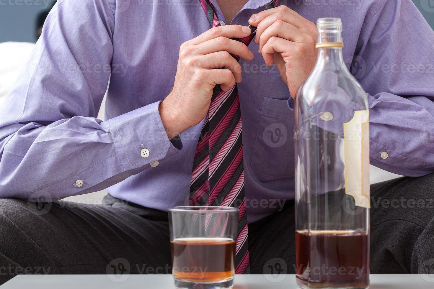 Businessman afterwork drinking photo