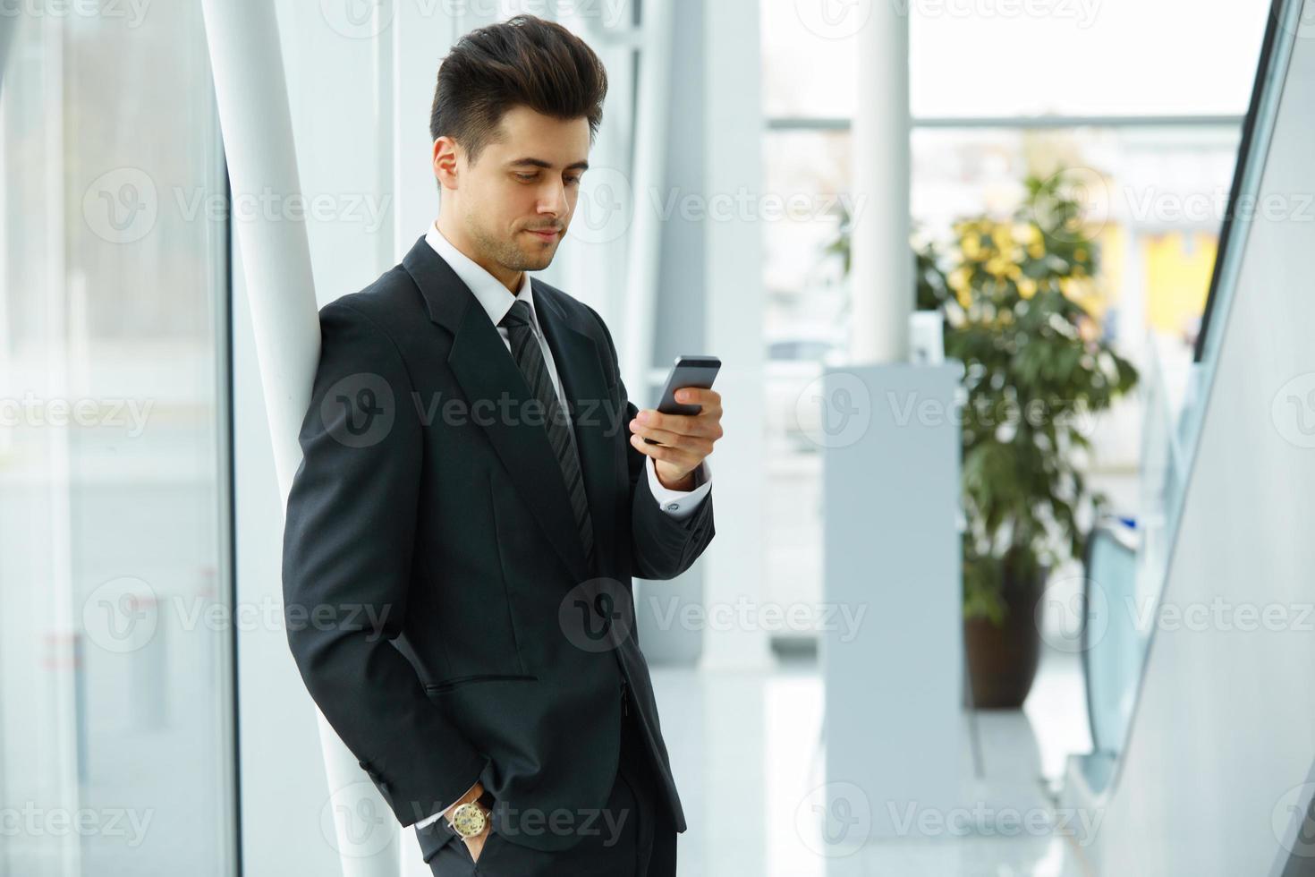 Businessman Using Cell Phone photo