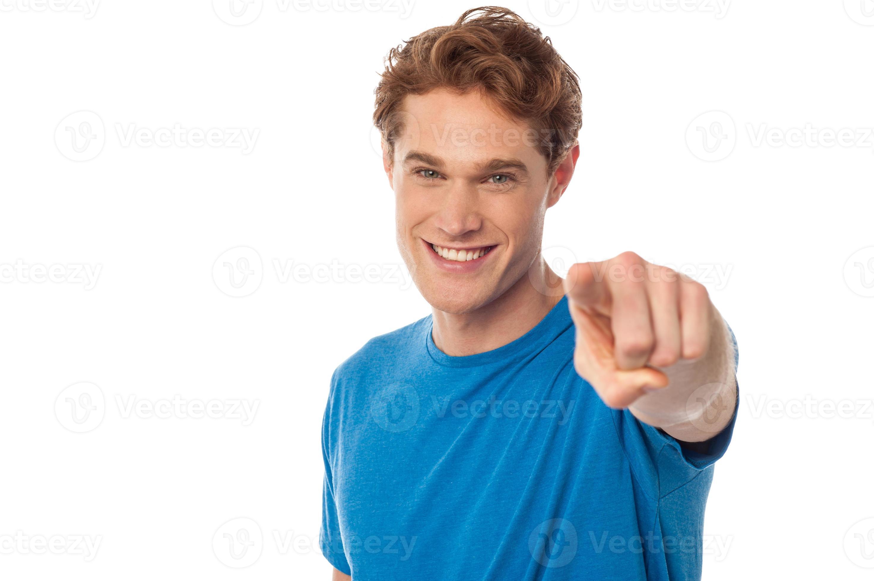 Cheerful man pointing towards camera 944512 Stock Photo at Vecteezy