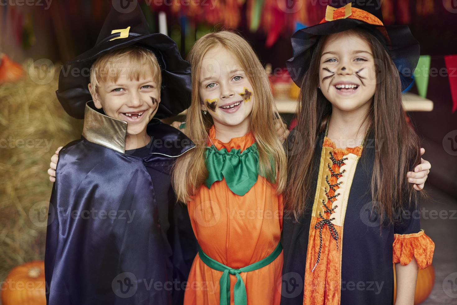 Cheerful children with Halloween face paint photo