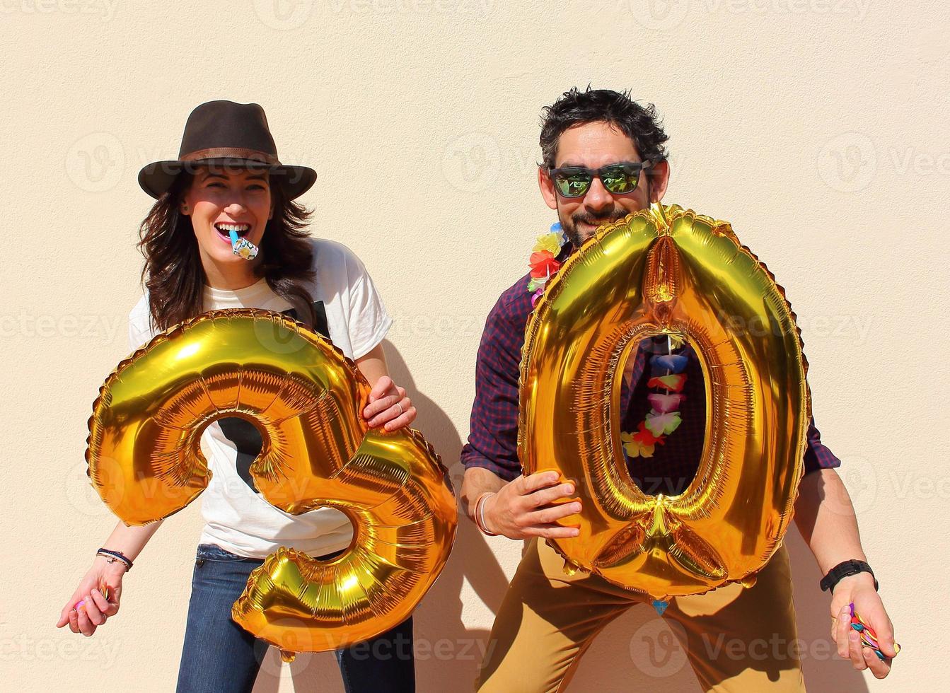 Cheerful couple celebrates a thirty years birthday photo