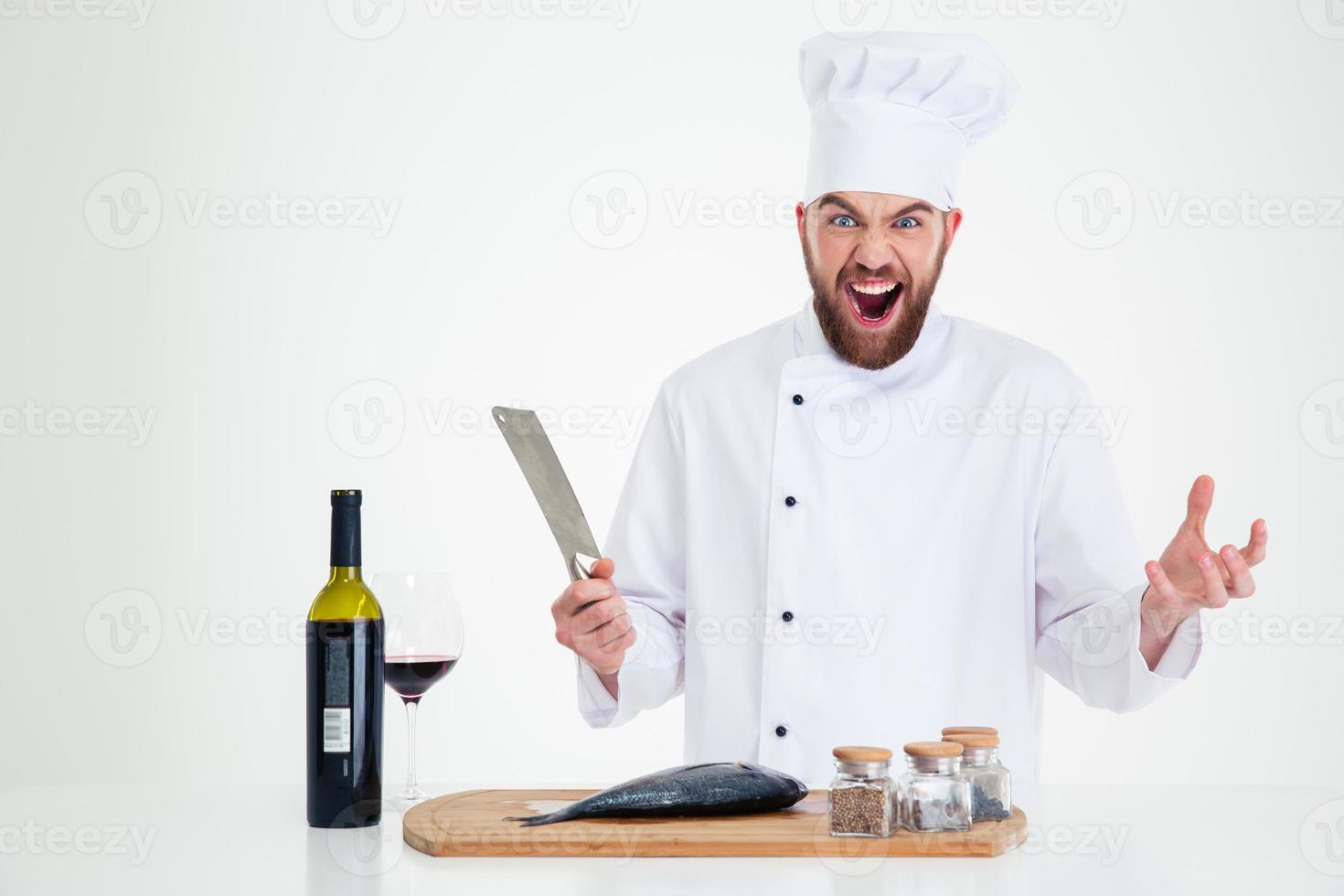Retrato de un alegre chef hombre cocinar pescado foto
