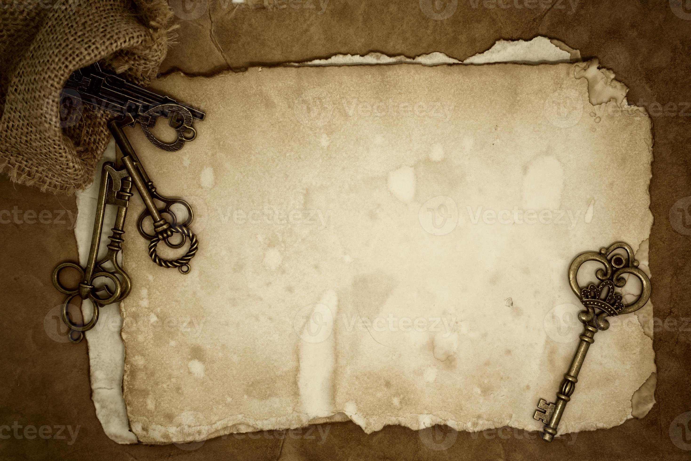 Vintage keys on old paper background 947568 Stock Photo at Vecteezy