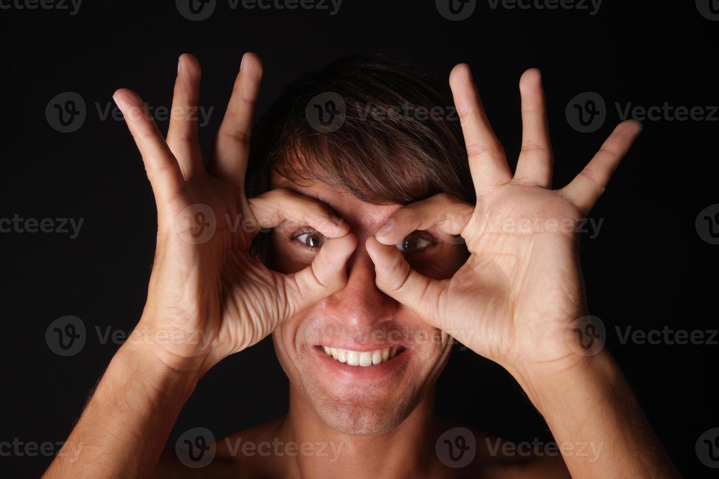 Young smiling man with funny spectacles 949097 Stock Photo at Vecteezy