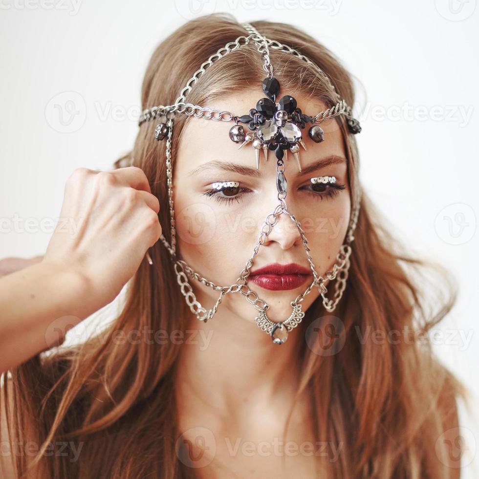 Professional Make-up artist applying makeup. photo