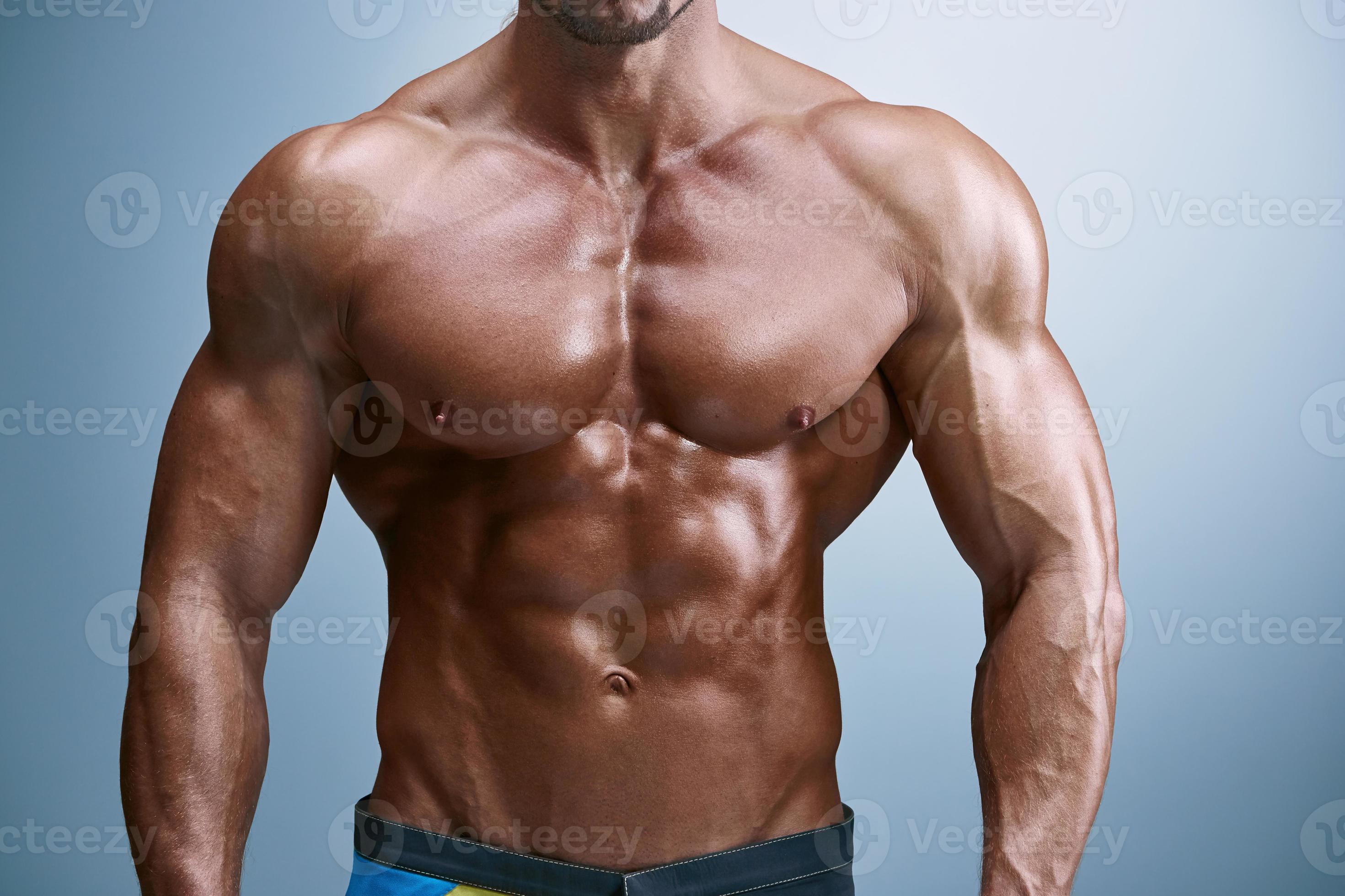 Attractive male body builder on blue background 949690 Stock Photo at  Vecteezy