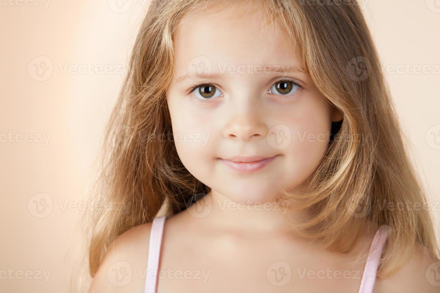 Happy little girl with beautiful big eyes photo