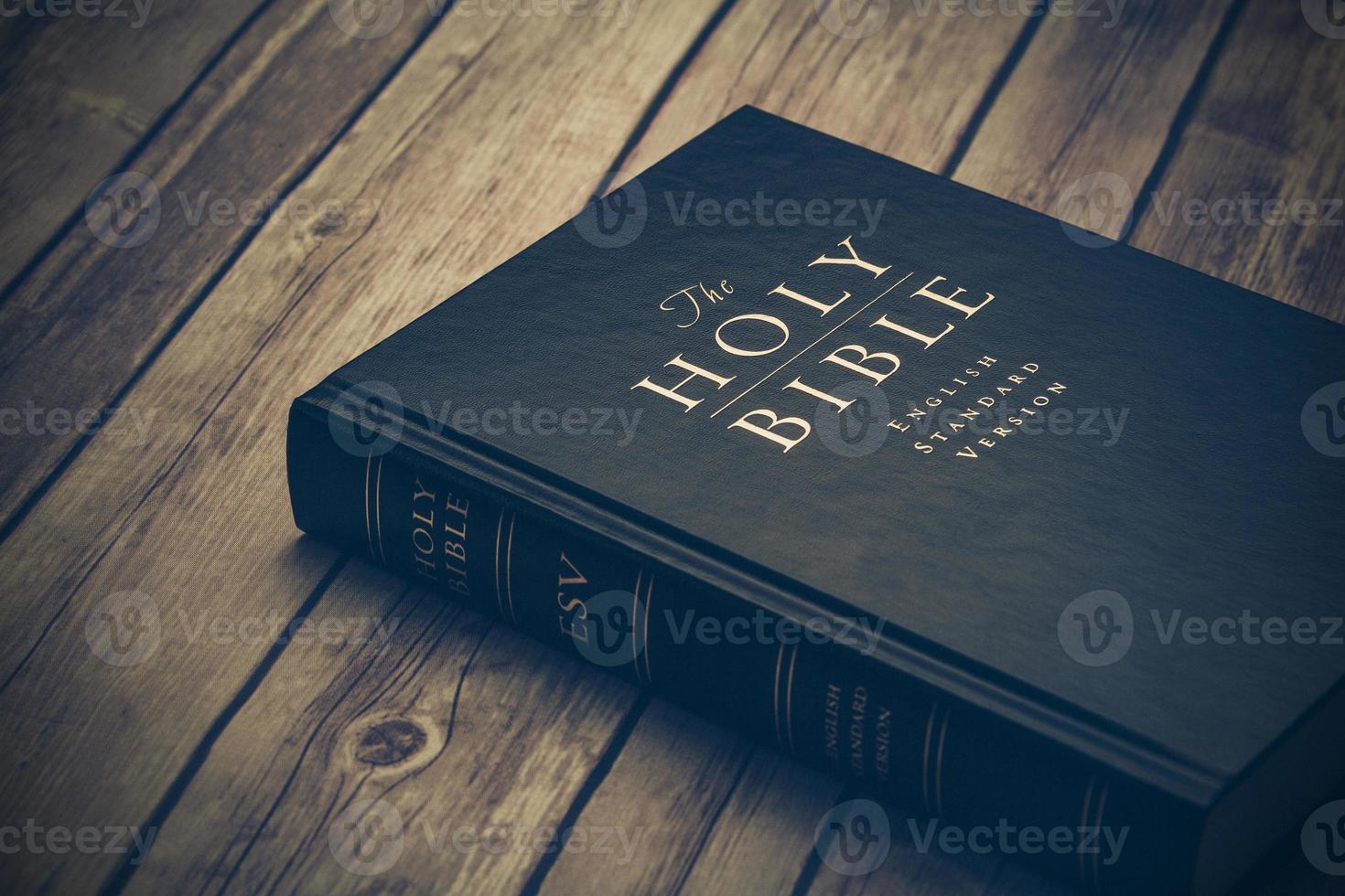 Bible on wooden table photo