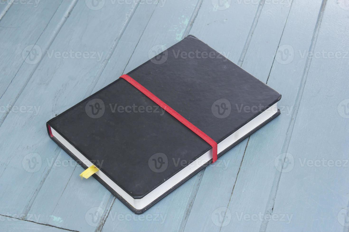 hardcover book on wood background photo