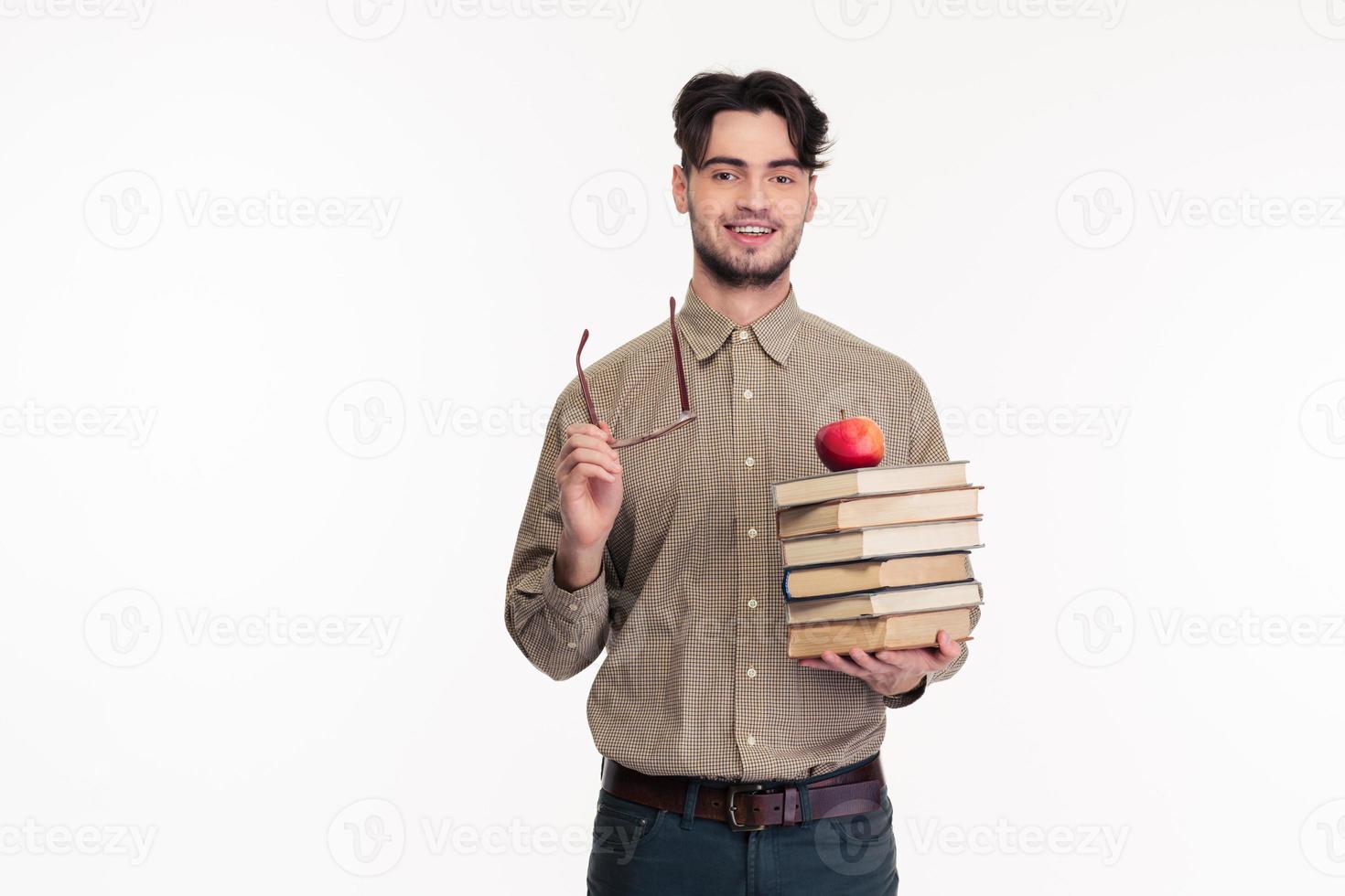 Casual man holding glasses and books photo