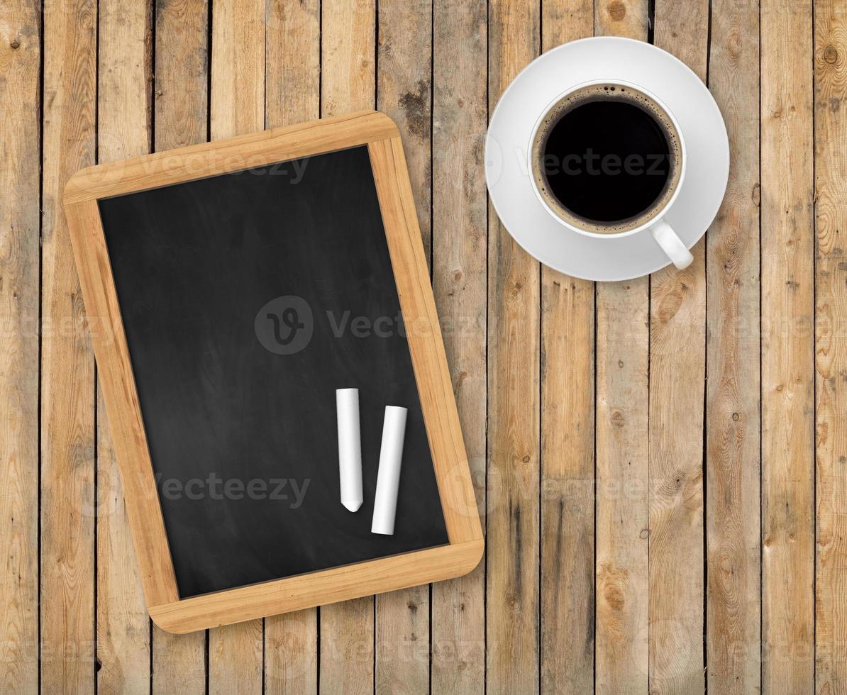 Wooden planks top view with chalkboard photo