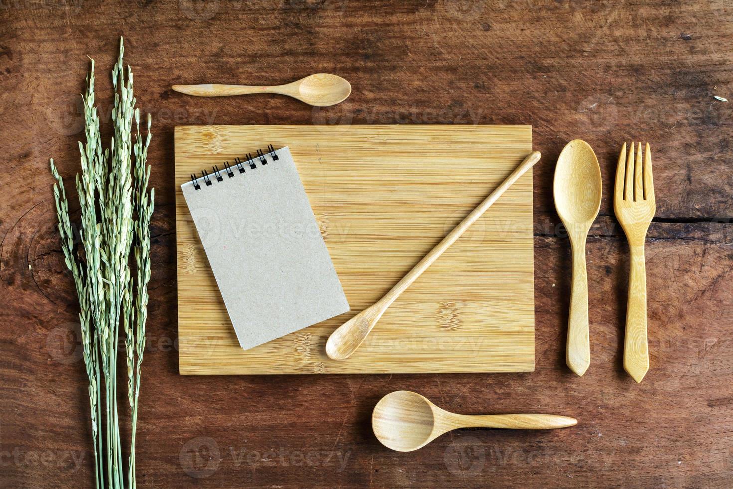 note and wooden utensil on old wood photo