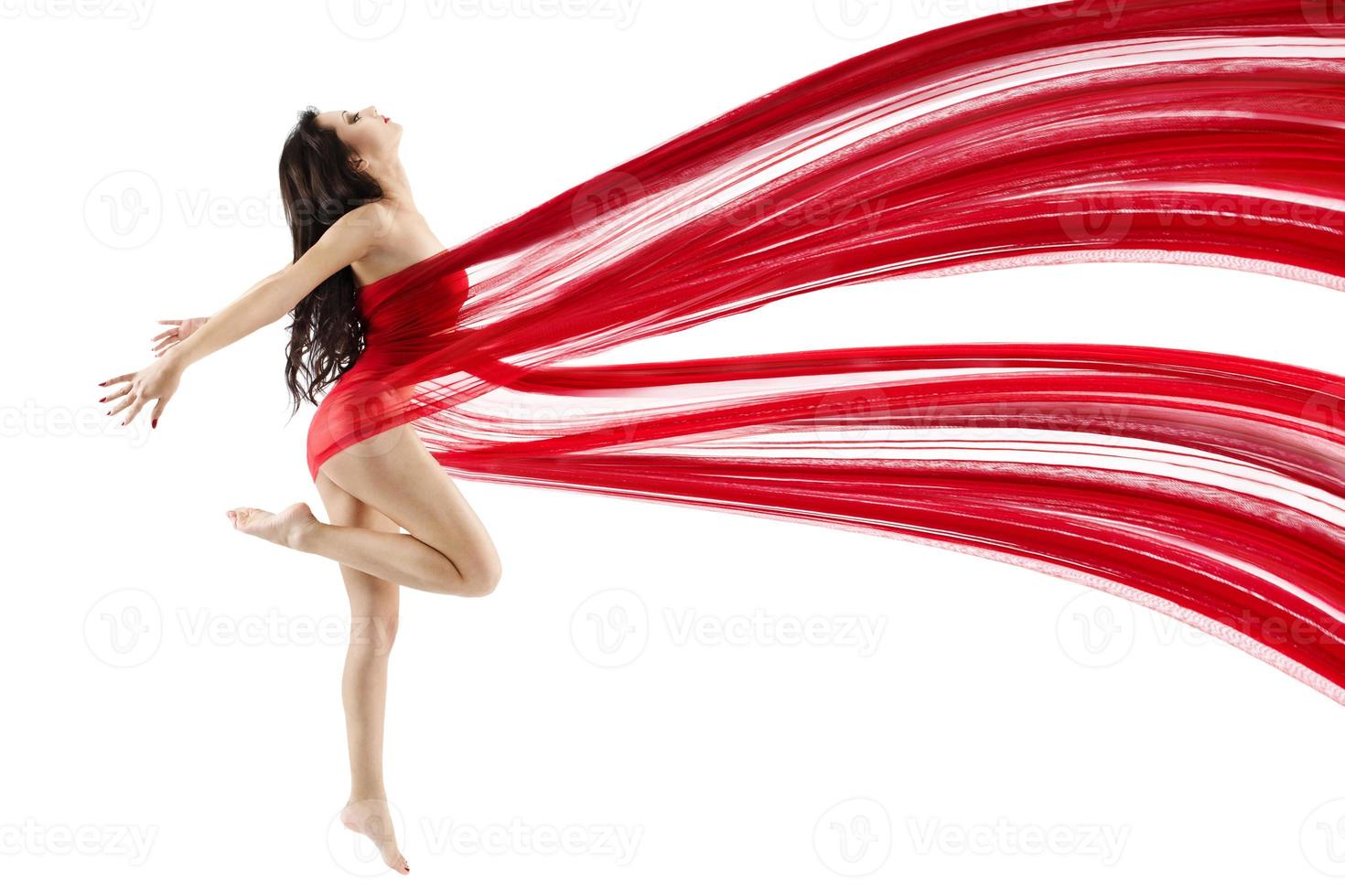 Woman dancing with red flying waving chiffon cloth photo