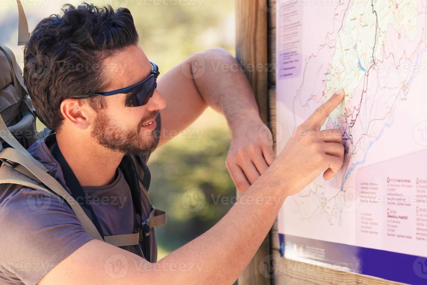 hiker studying the map photo