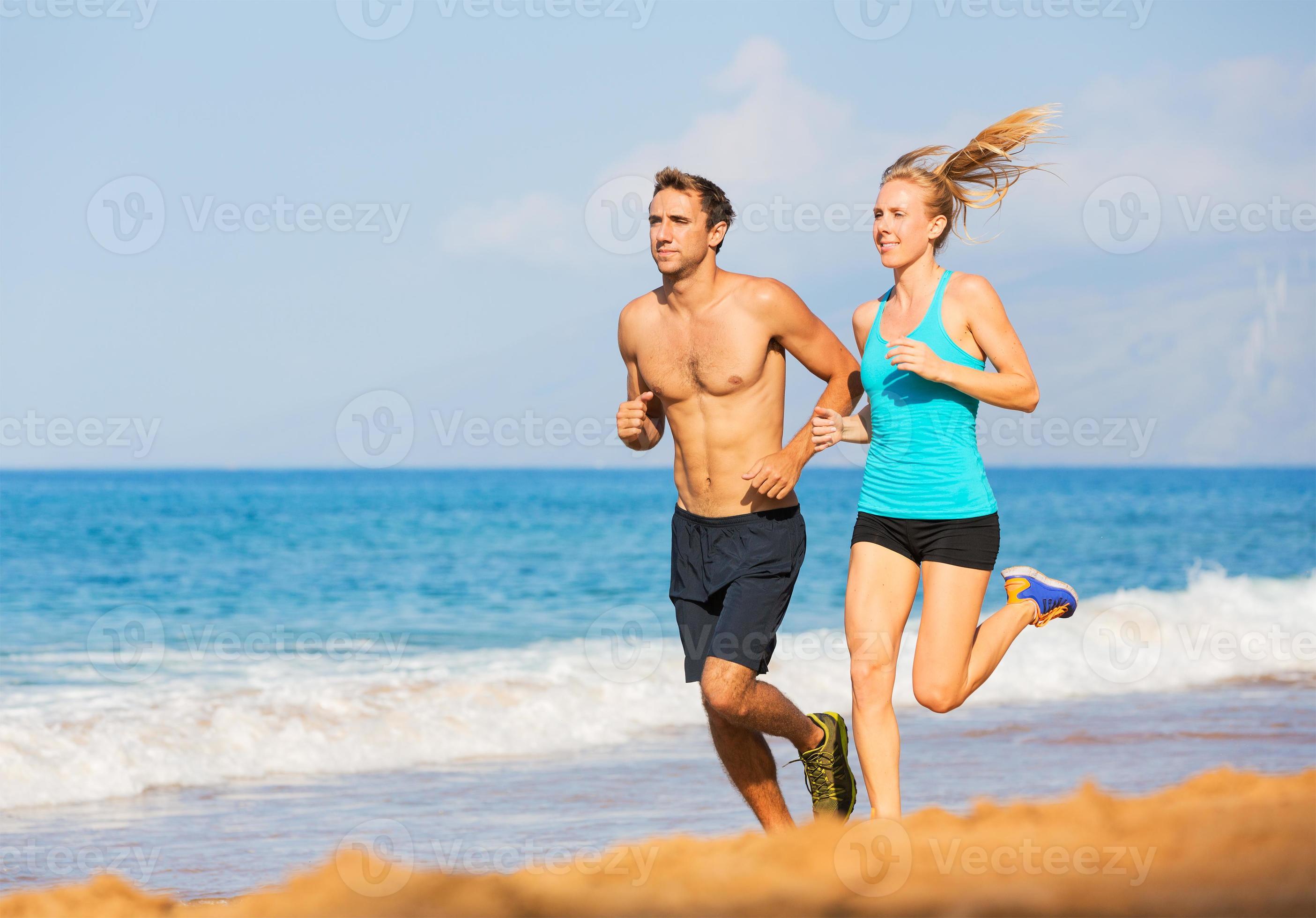 Couple running on the beach 955149 Stock Photo at Vecteezy