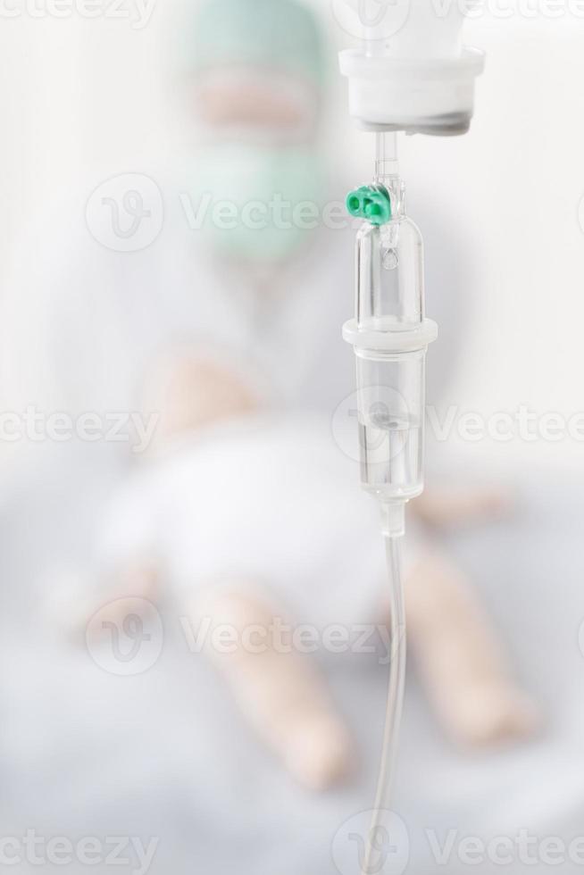 Doctor examing newborn photo