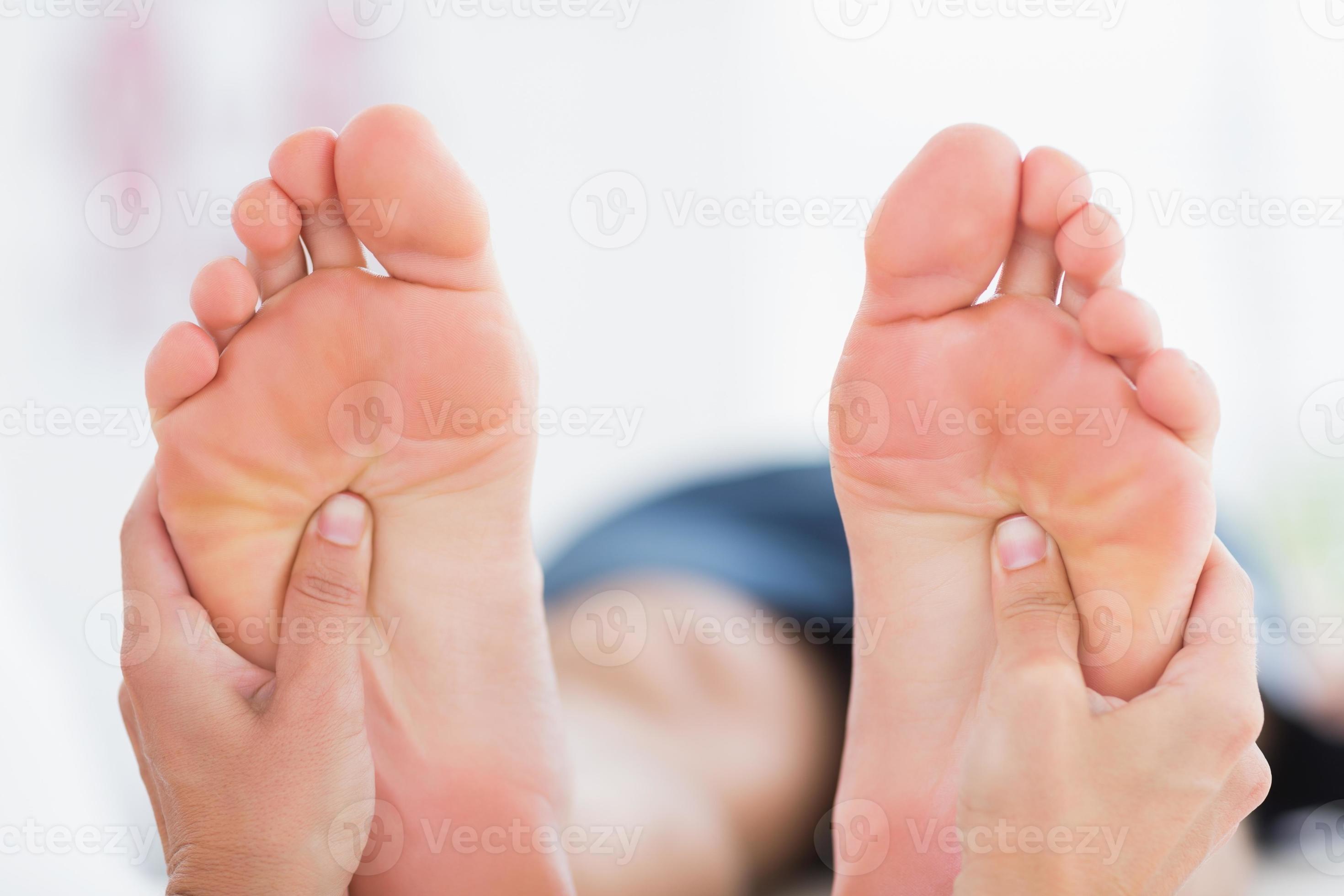 Man having feet massage 955706 Stock Photo at Vecteezy
