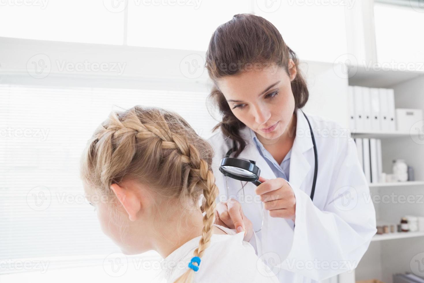 Doctor examining a smiling patient photo