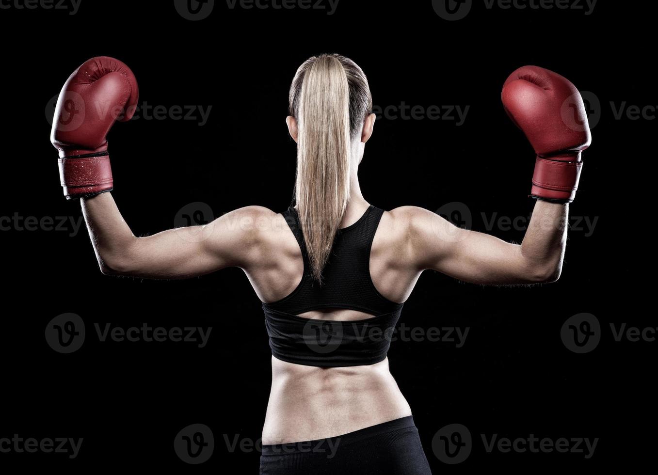 Beautiful woman wearing boxing gloves photo