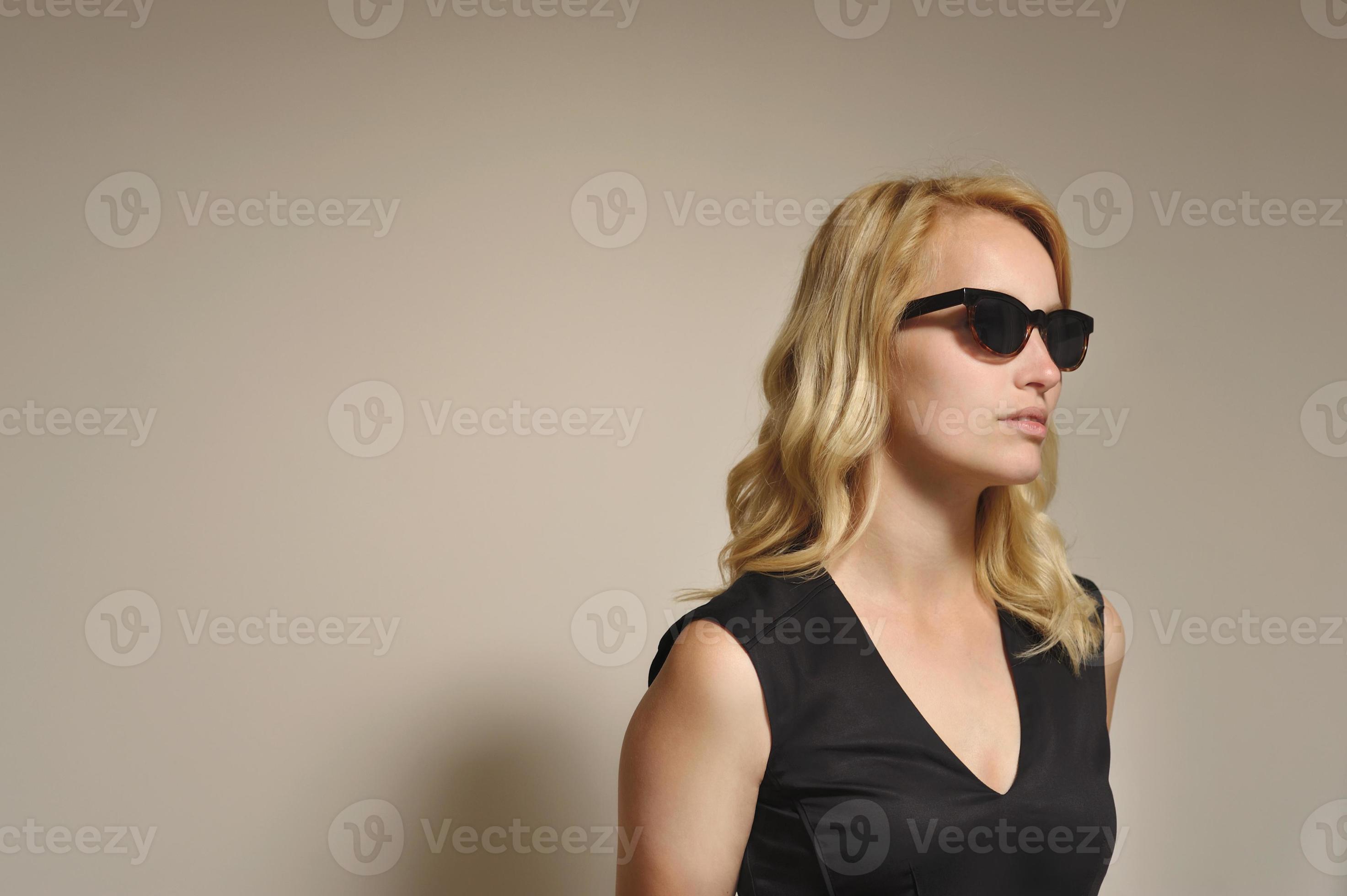 Blonde woman wearing black sunglasses