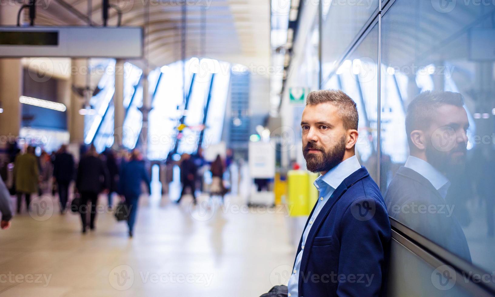 Businessman in subway photo