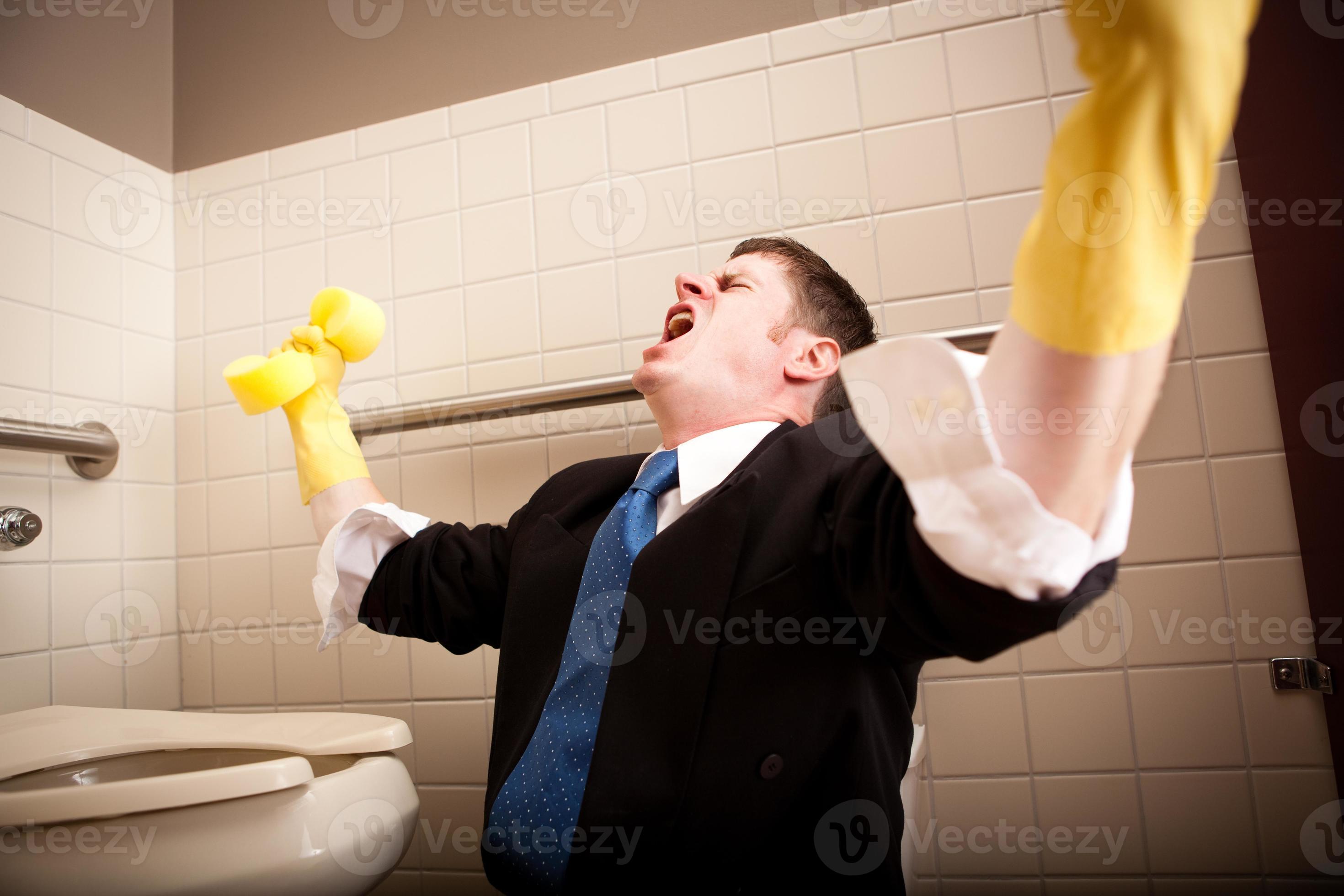 Angry, Screaming Businessman Cleaning the Restroom Toilet 961330 Stock