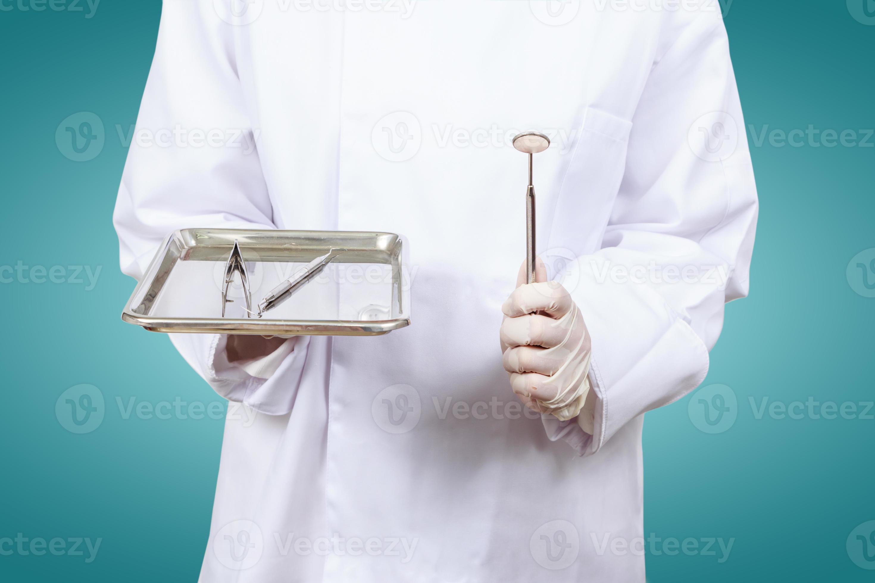 Hand  of dentist or dental assistants. hold Dentists tools . photo