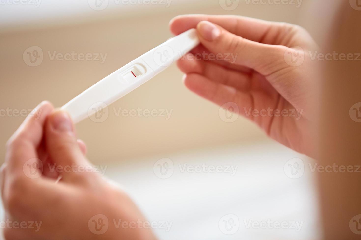 Woman Holding Pregnancy Test photo