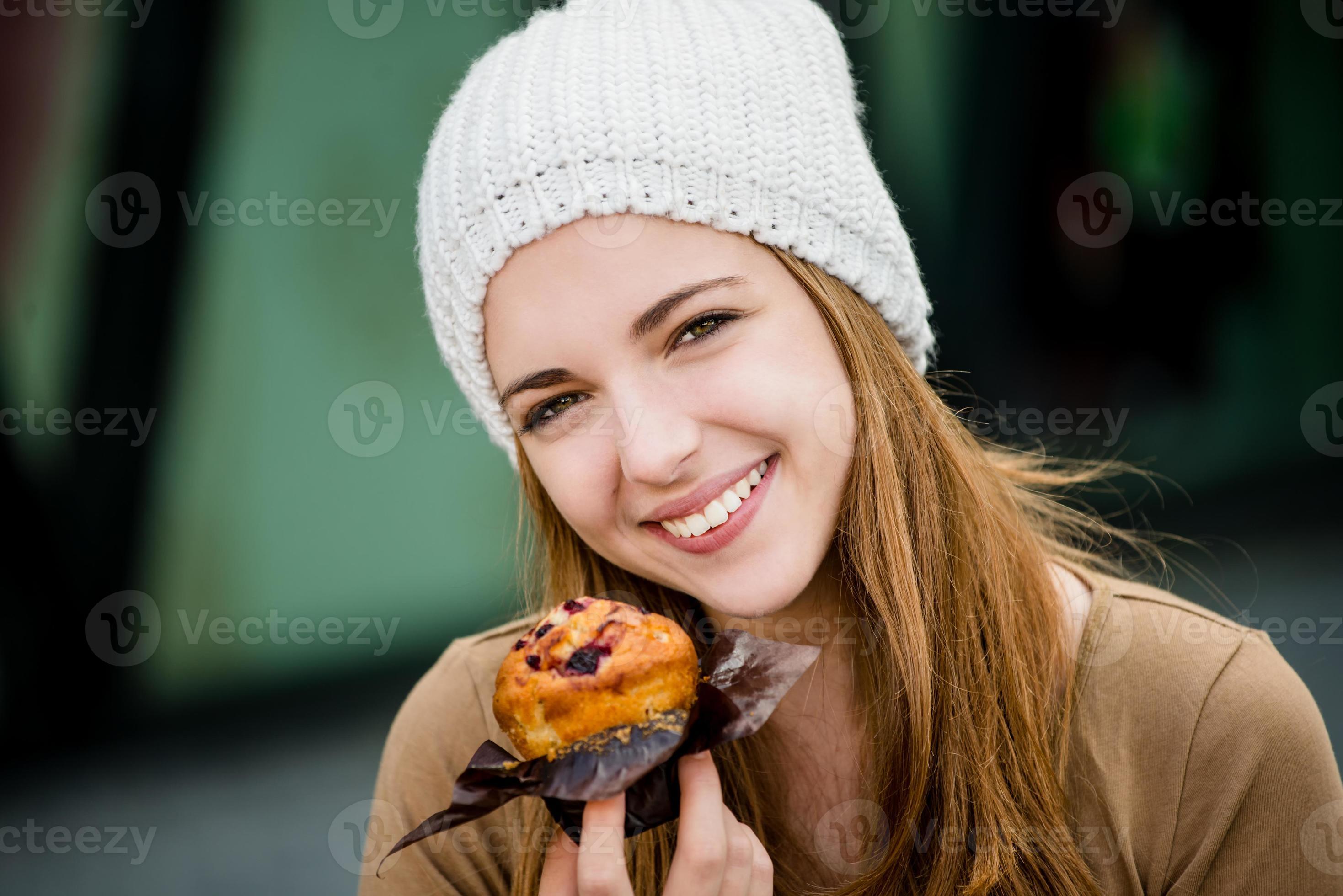 Teenager eating muffin 963186 Stock Photo at Vecteezy