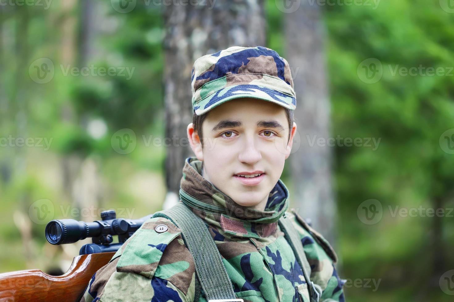 Young recruit with optical rifle photo