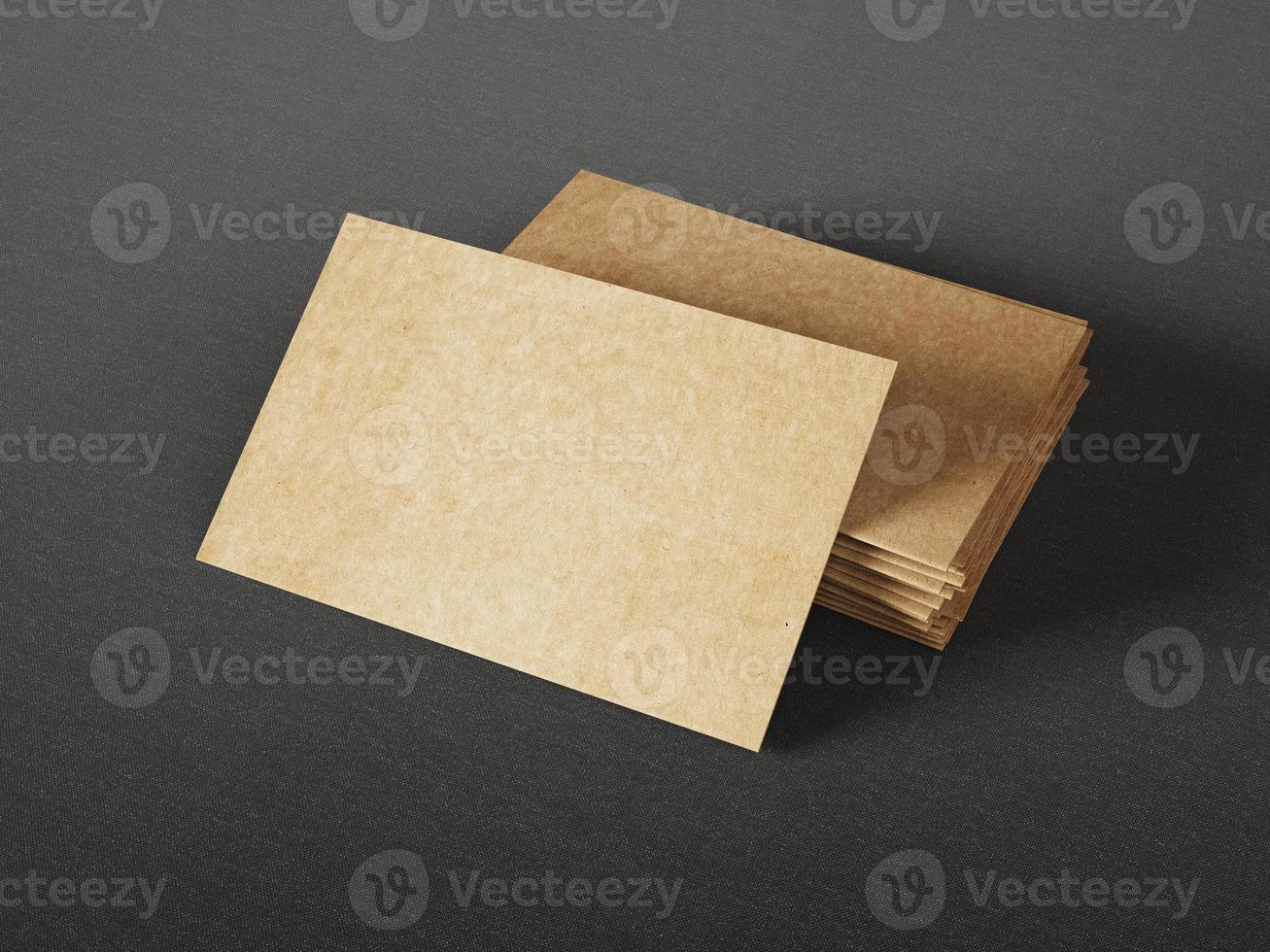 Cardboard business cards on dark background photo