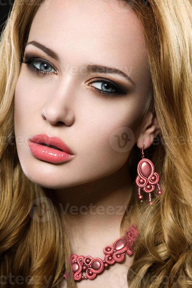 Beautiful girl with perfect skin and evening makeup. photo