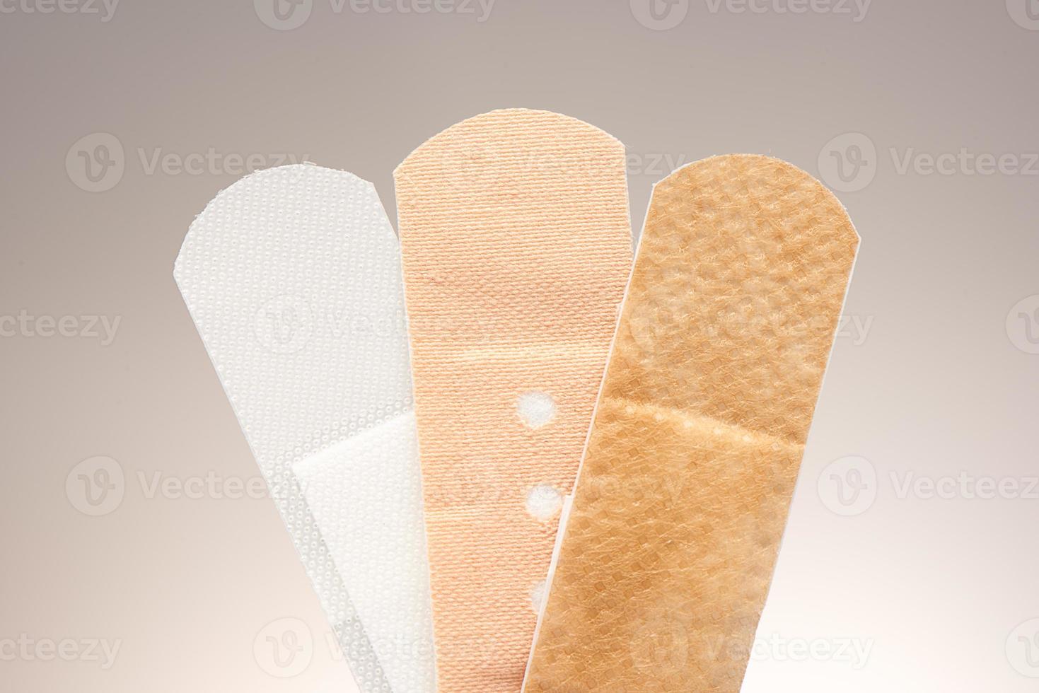Set of three medical adhesive plasters with different purposes photo