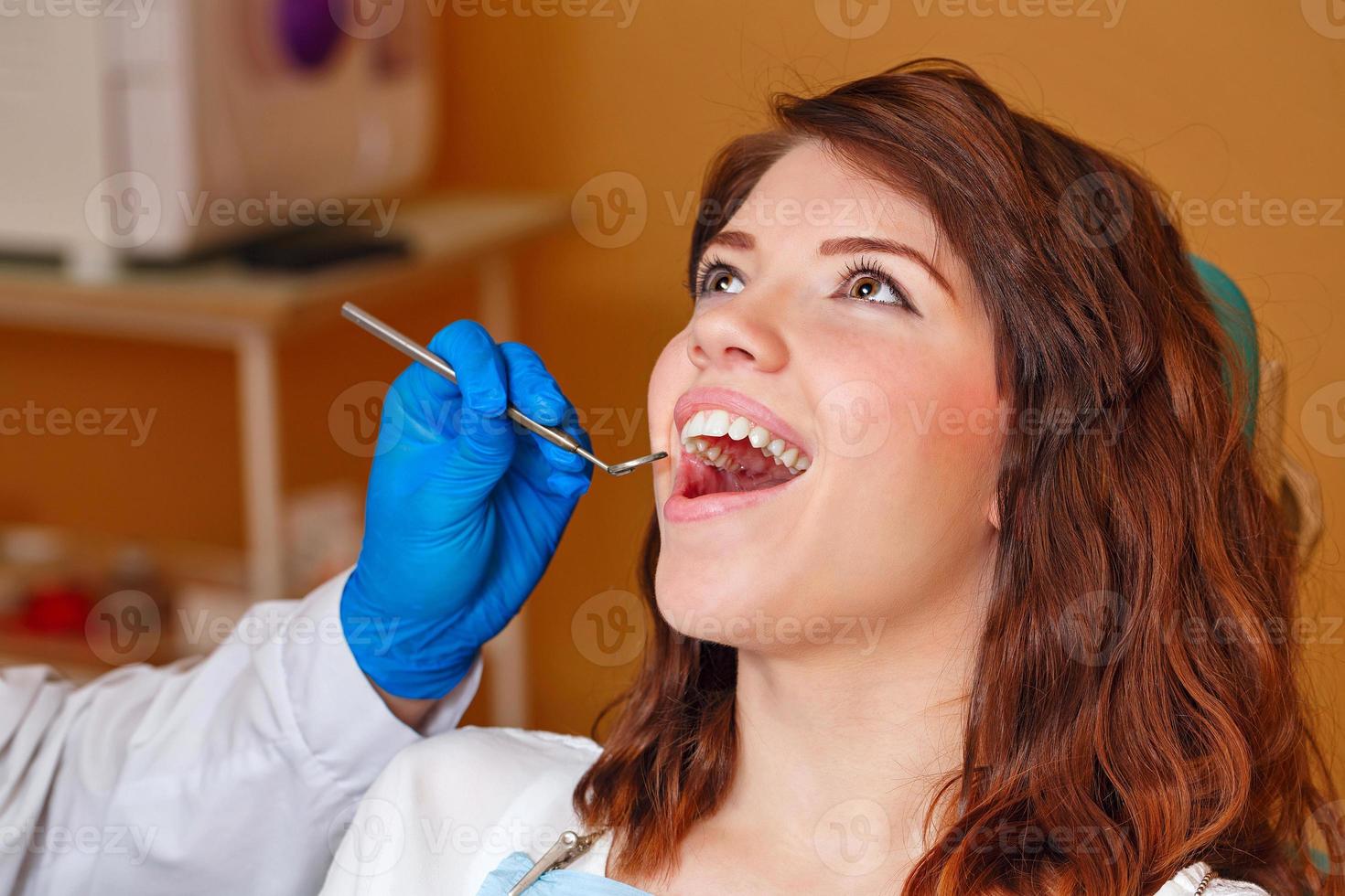 Girl on examination at dentist photo