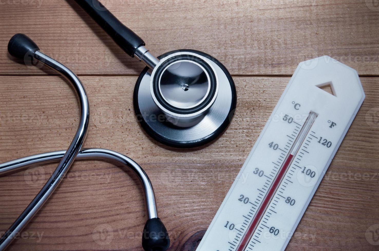 Stethoscope and thermometer photo