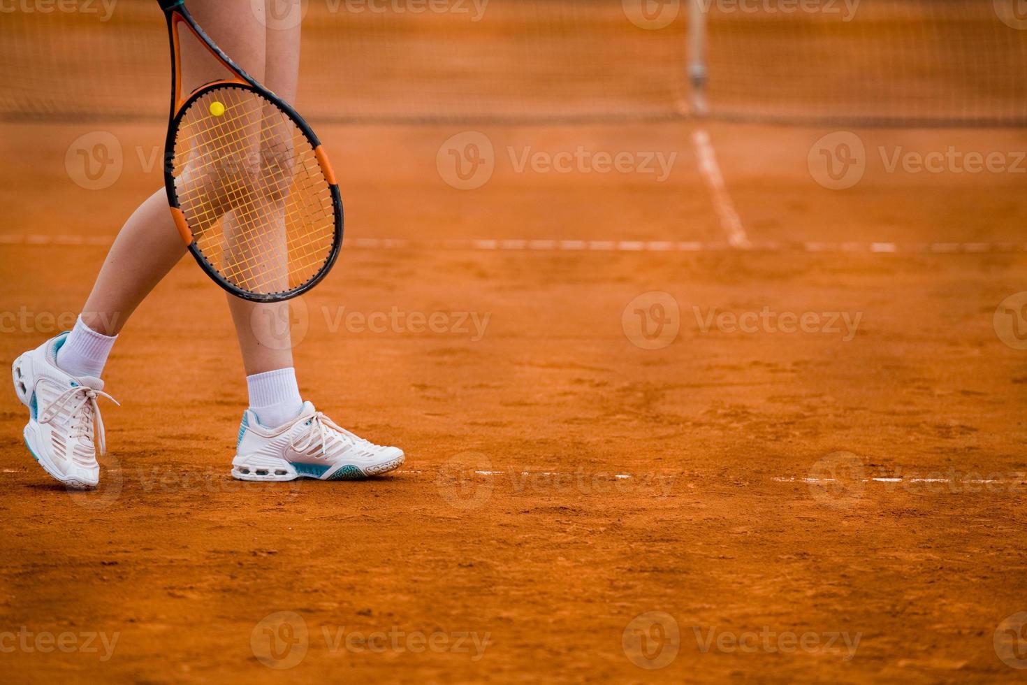 Clay tennis court and player concept photo