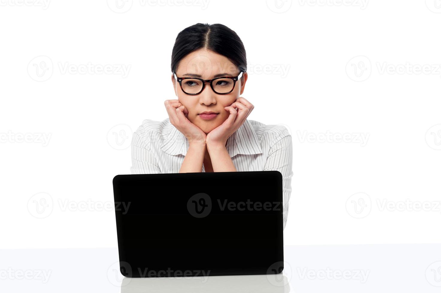 Asian corporate woman thinking something photo