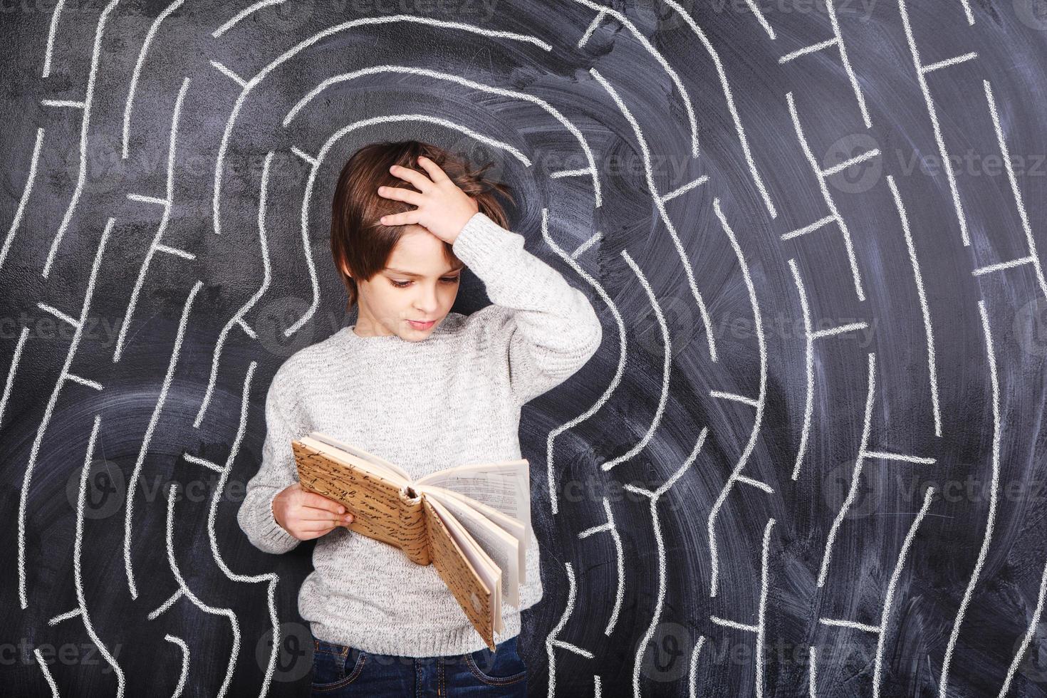 Boy trying to solve the maze 990817 Stock Photo at Vecteezy