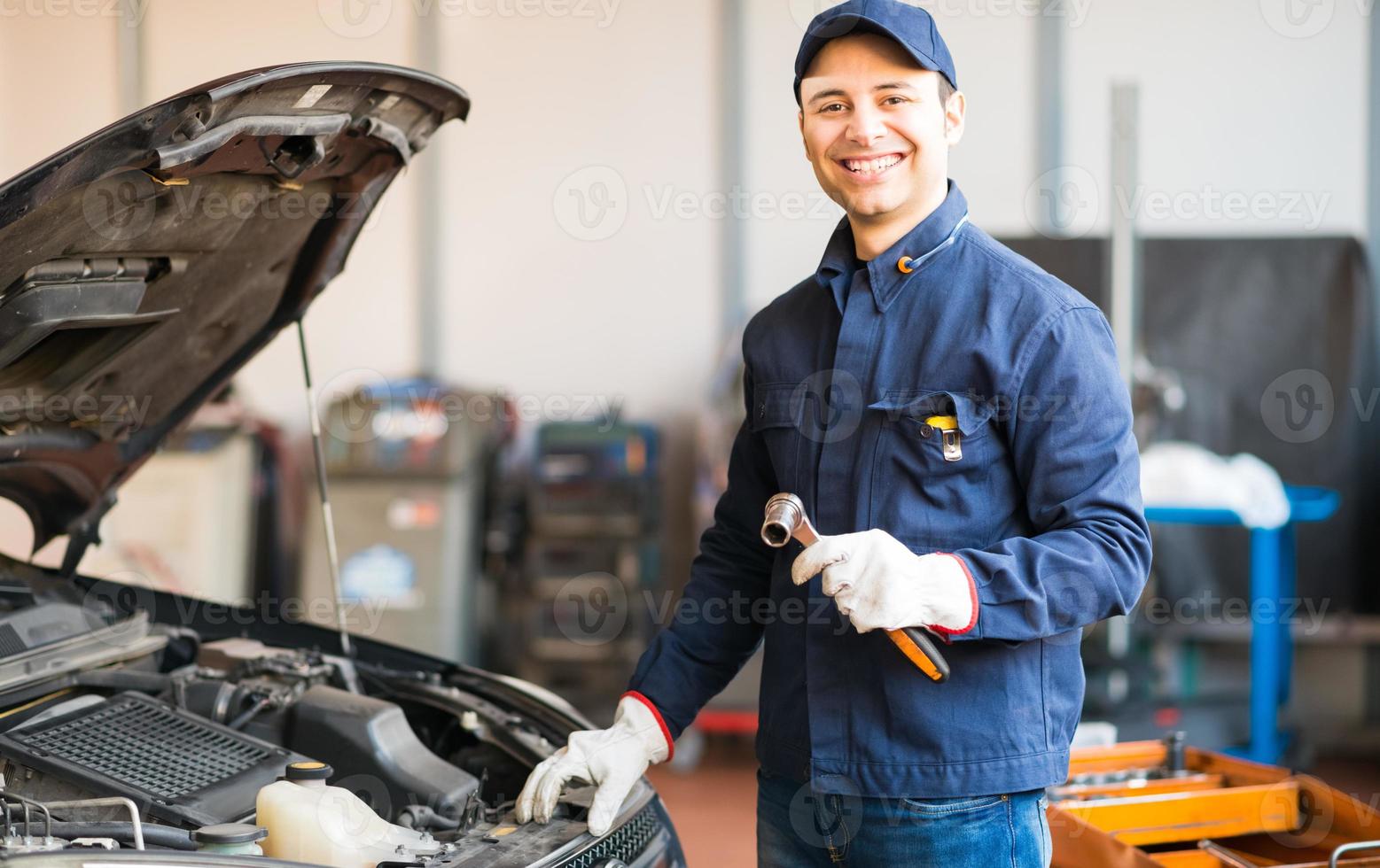 Mechanic holding a wrench photo