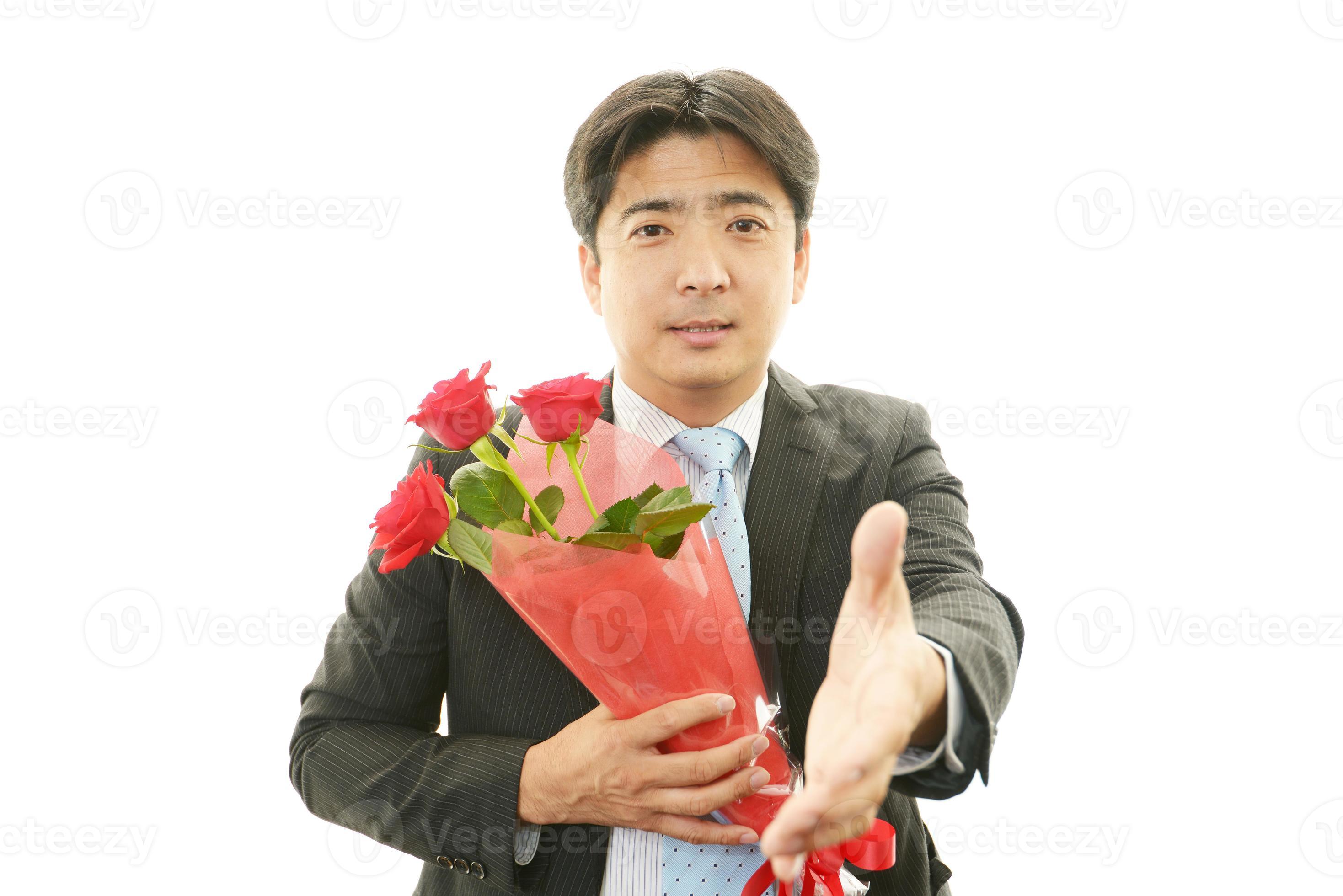Man holding flower bouquet 992754 Stock Photo at Vecteezy