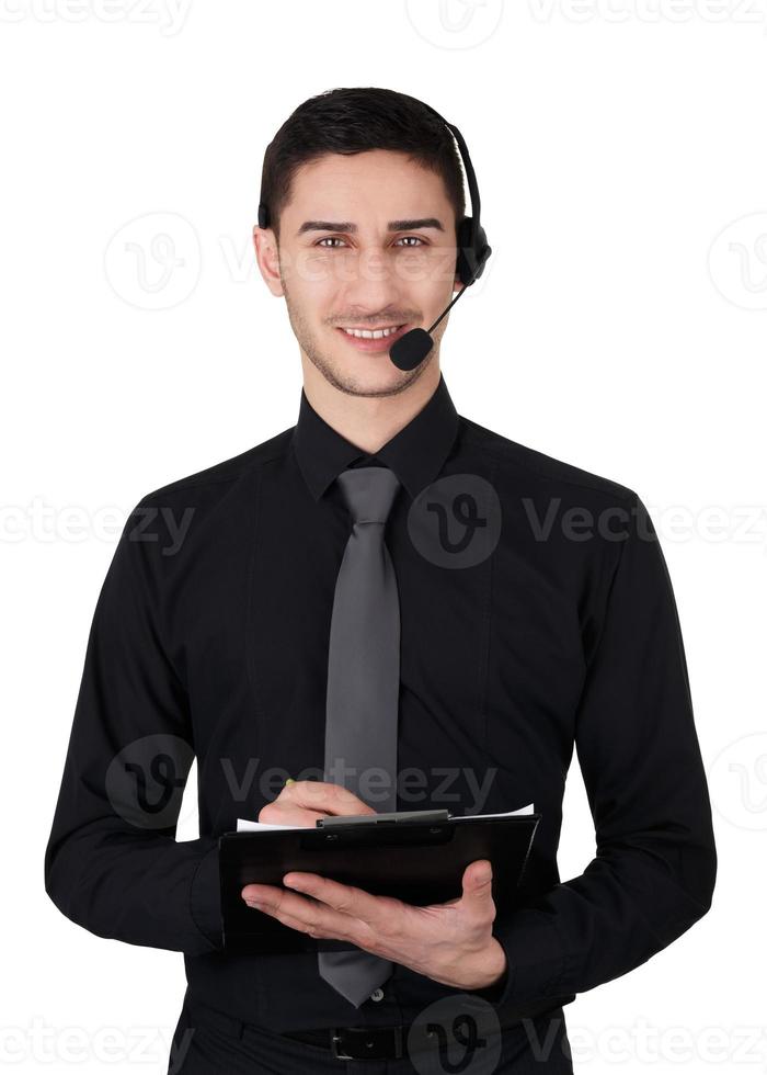 Call Center hombre con auriculares y portapapeles aislado en blanco foto