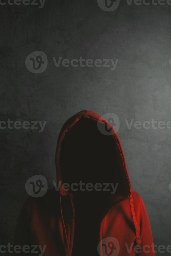 Unrecognizable person wearing red hooded shirt photo