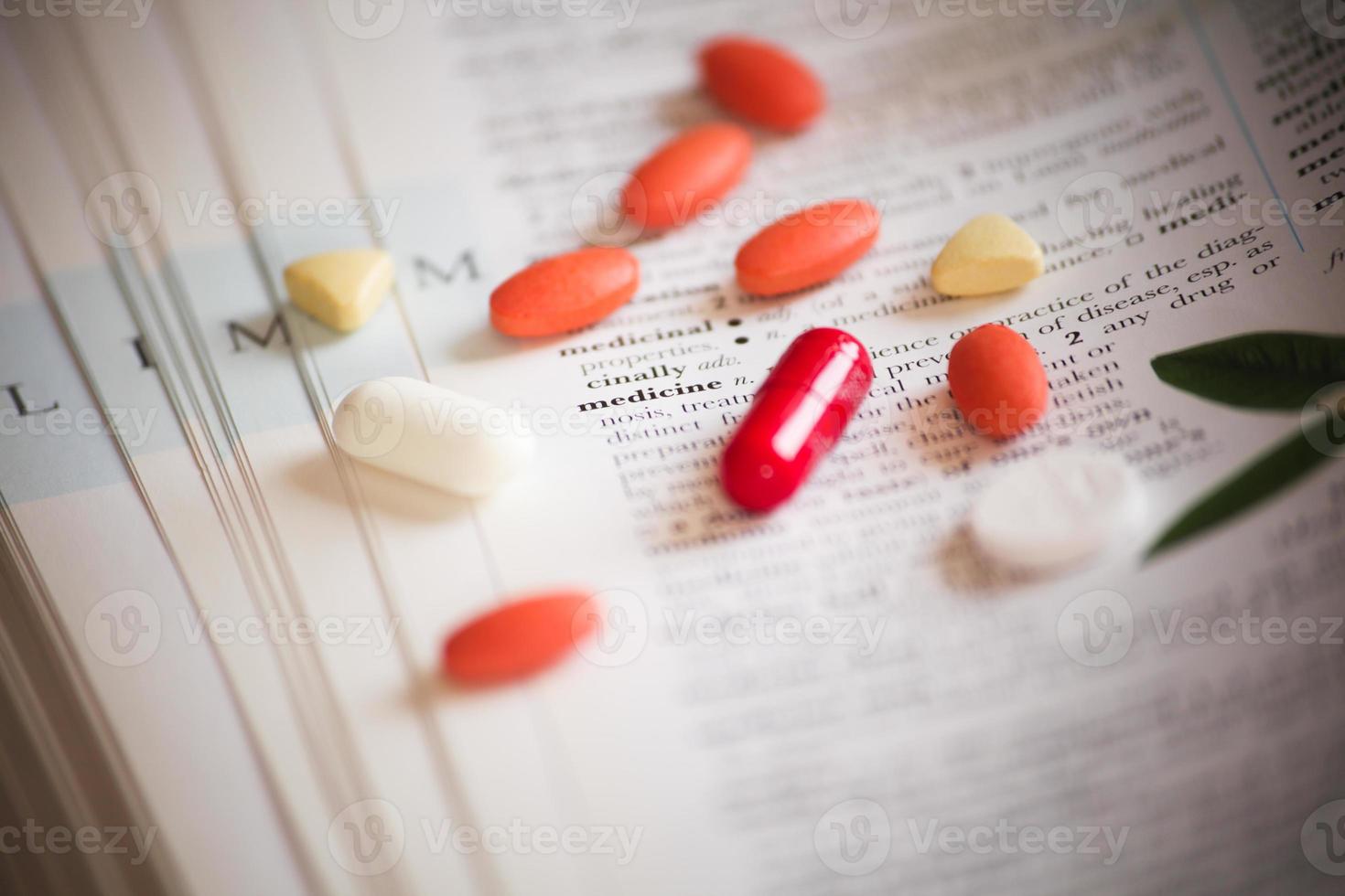 Medicine on books as medical background photo
