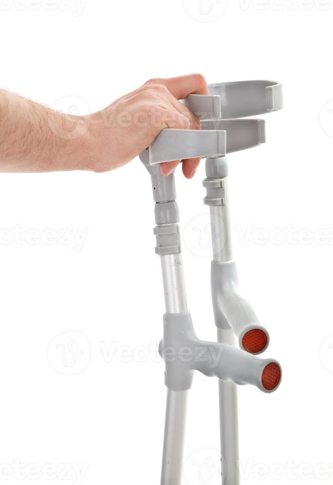 hand holding crutches photo